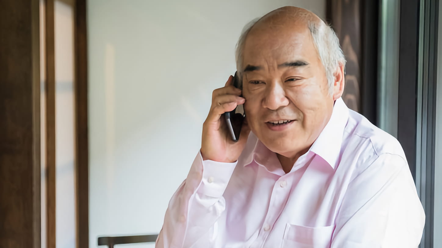 A man talking into a wireless phone