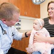 doctor talking to baby girl_square
