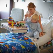 mother-sitting-with-toddler-hospital-bed