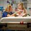 nurse-checks-girls-heartbeat-on-hospital-bed