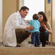 pediatrics-squatting-with-infant-_50D6014-square
