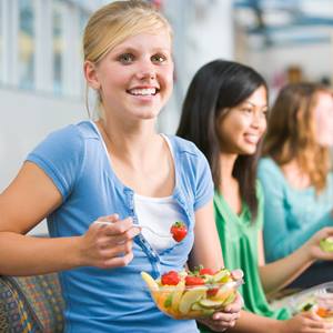 nutrition-young-woman-eating-fruit-1101783-square