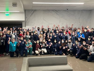 Caregivers gather for picture at hospital opening