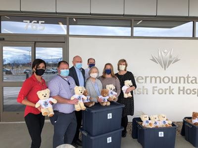 Group gathering for teddy bear donation