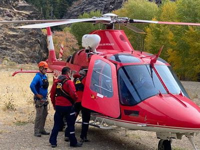 Group of Life Flight members enter helicopter