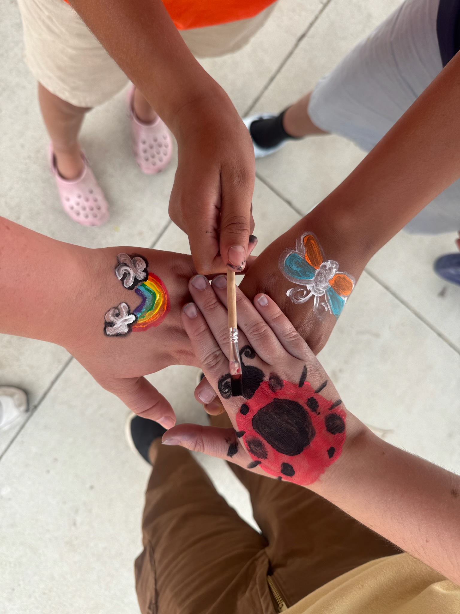 Student hands painted
