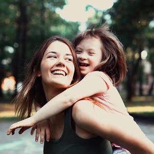 Little-Girl-With-Special-Needs-And-Mom