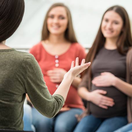 Pregnant women take a childbirth class