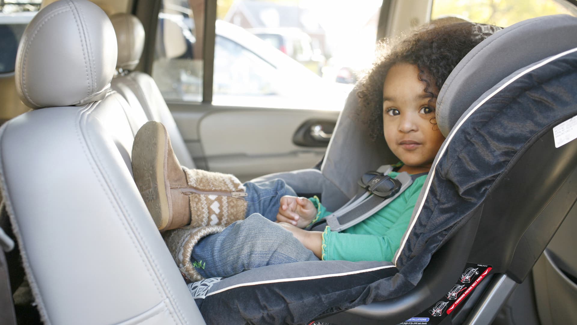 Can my child wear a coat in their car seat?