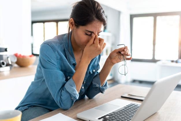 woman stressed at a computer