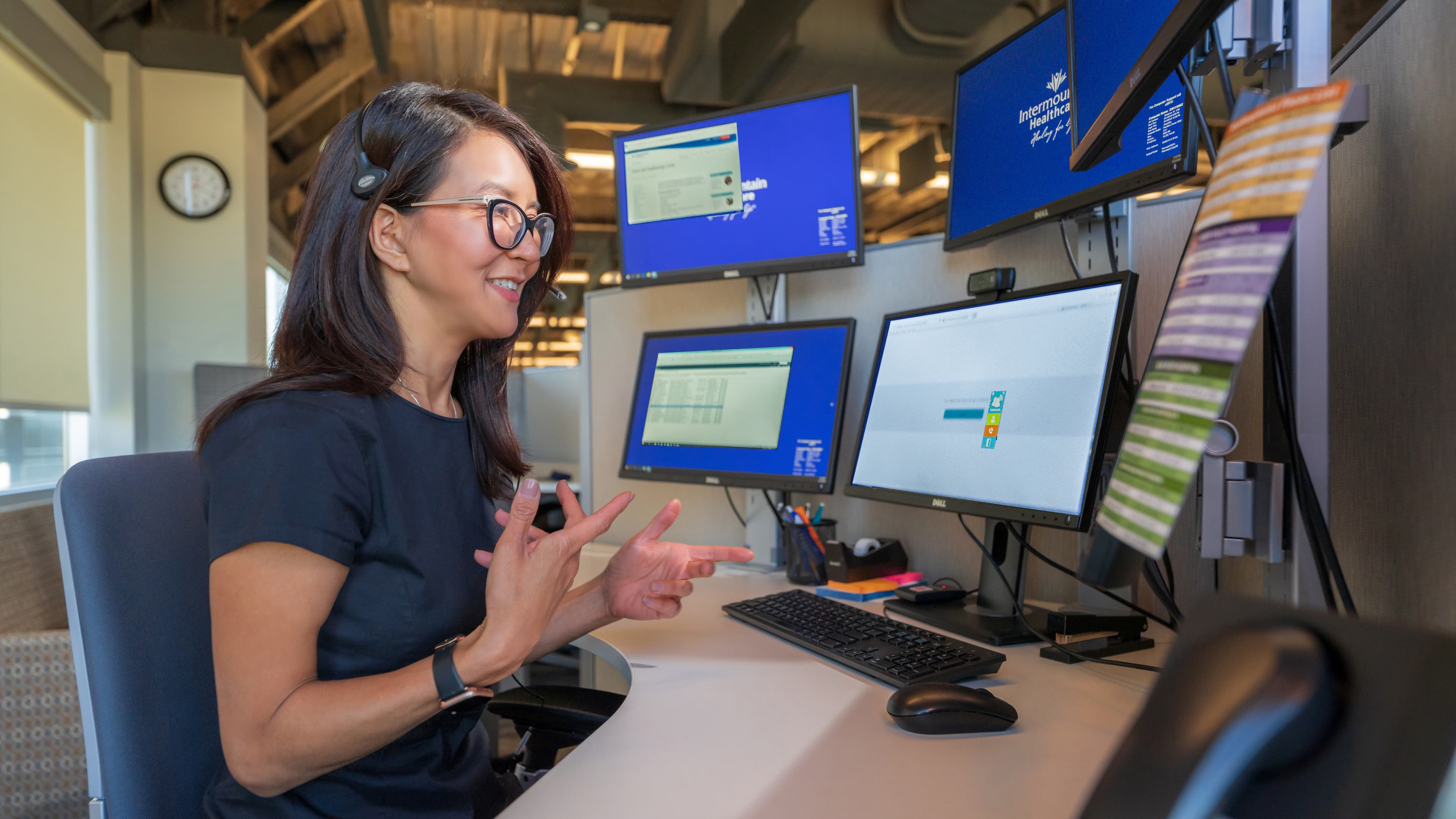 telehealth provider at her desk talking to a provider