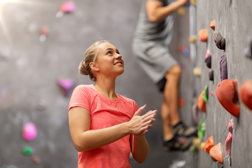 woman at rock climbing wall