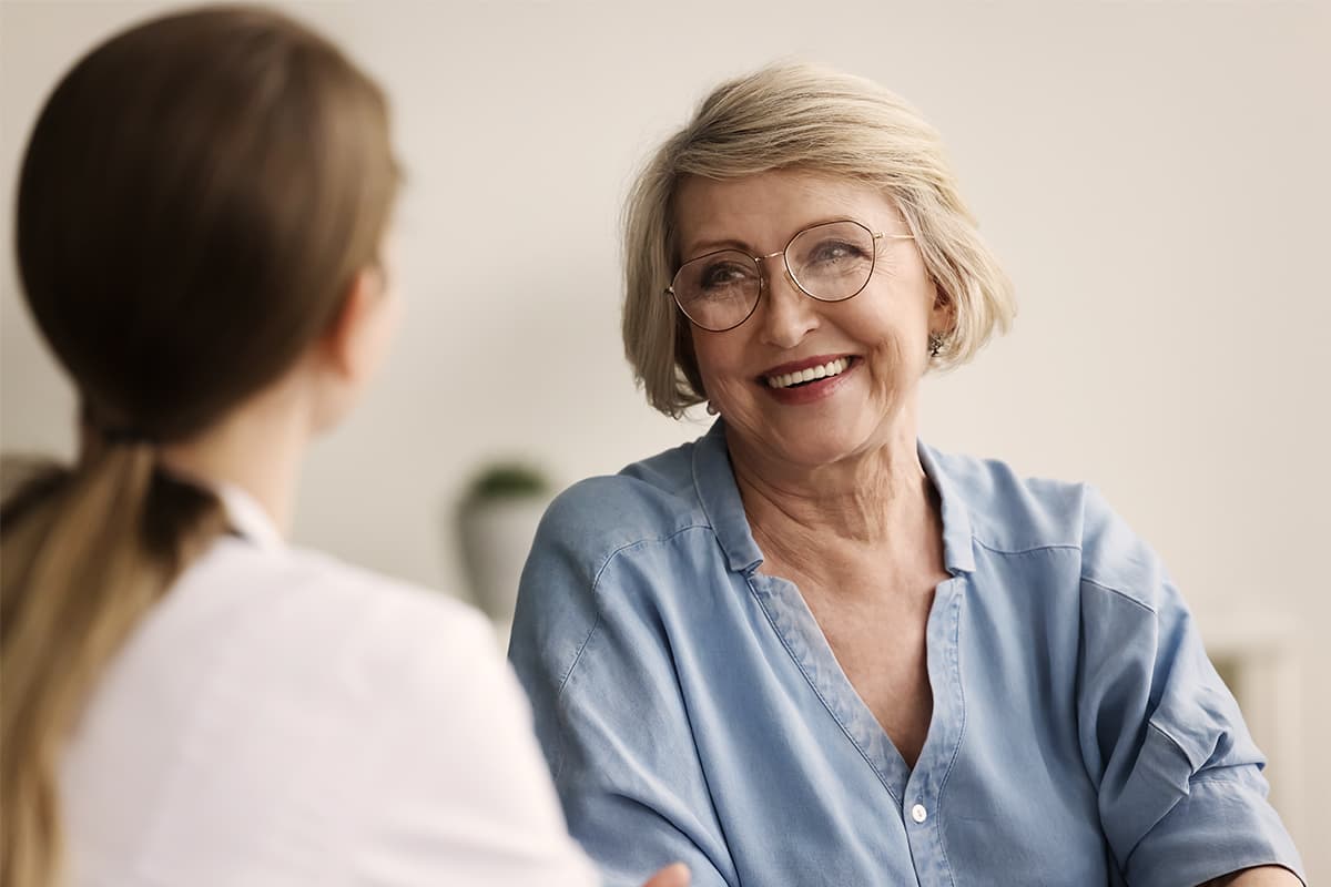 Senior woman talking to a doctor