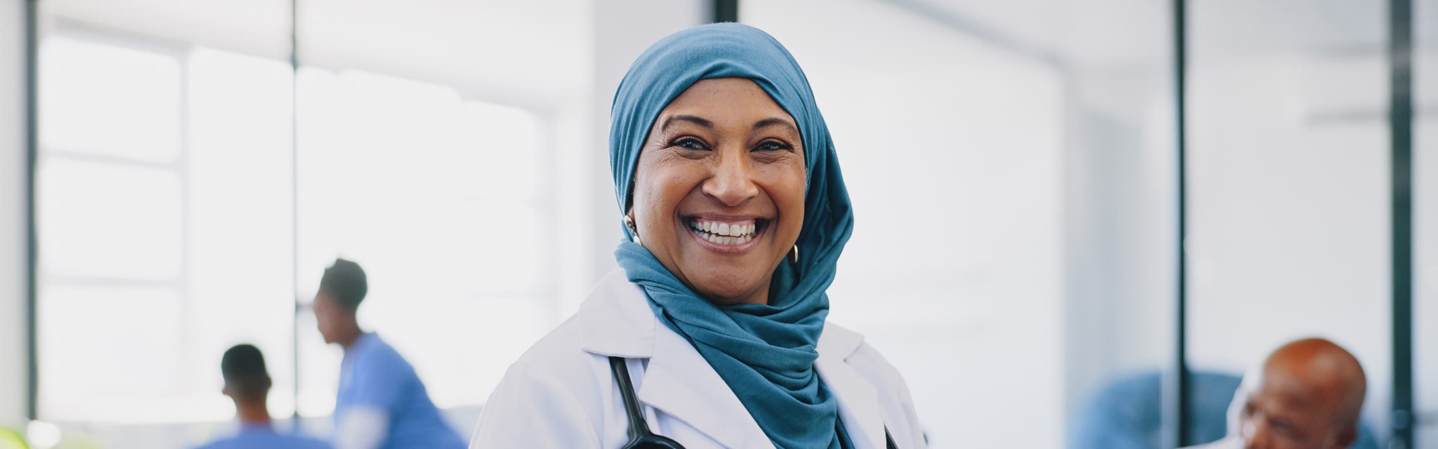 Female doctor wearing a hijab and smiling 