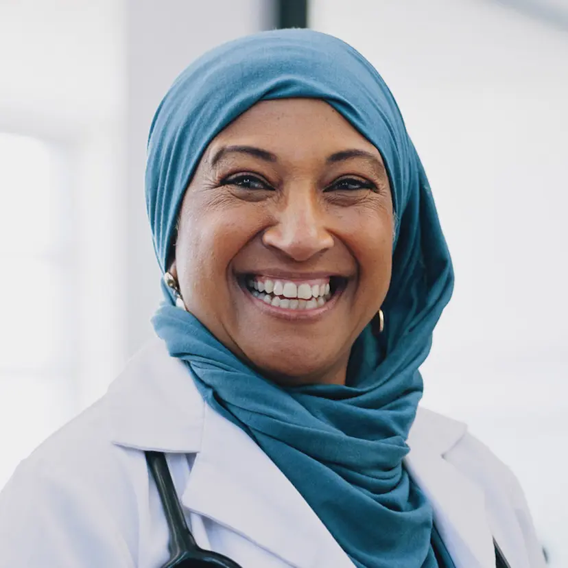 female doctor smiling wearing a hijab