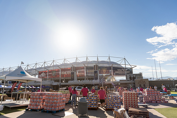 A view of Real Salt Lake soccer stadium and pallets of donation supplies
