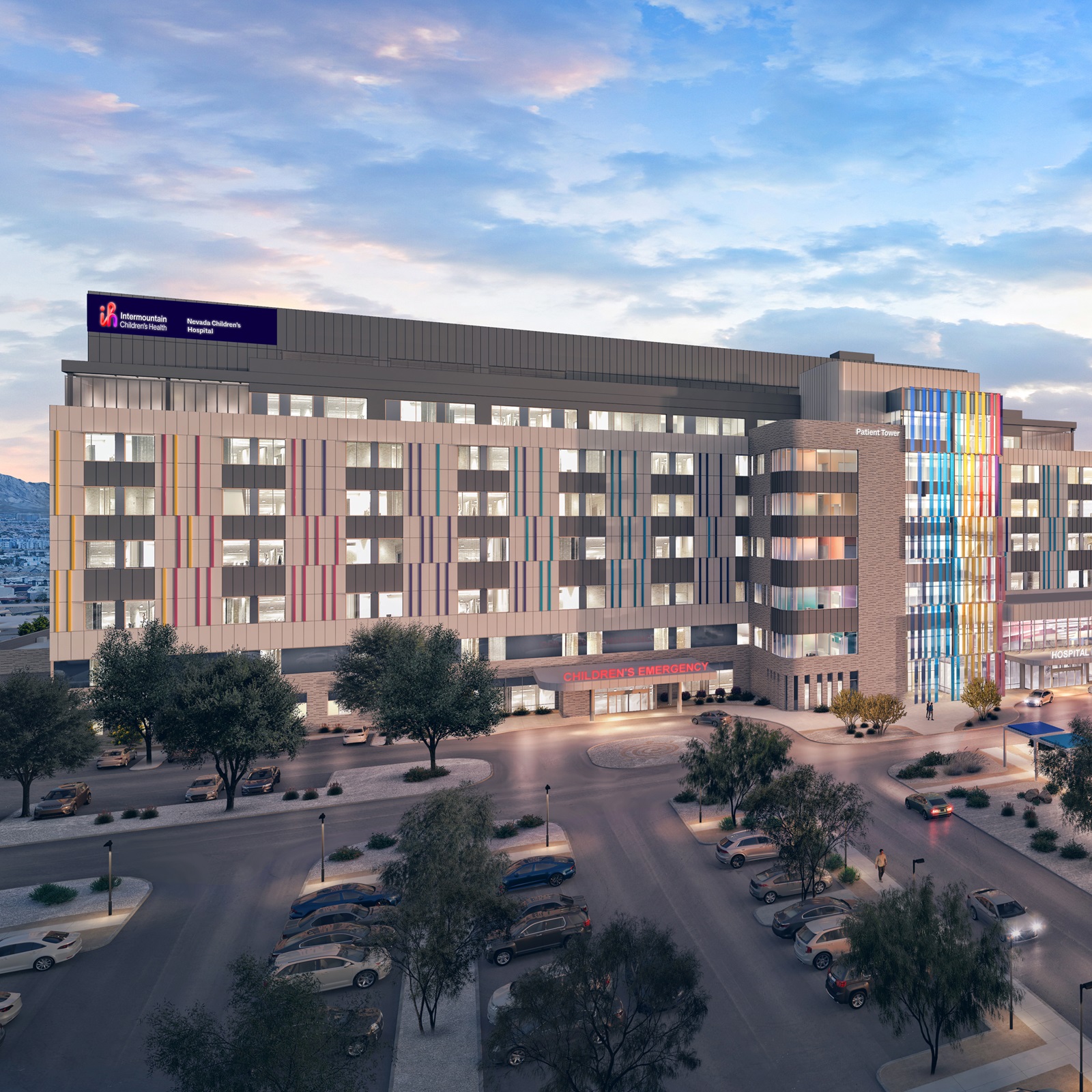 Architect's rendering of the planned Intermountain Nevada Children's Hospital, a multi-story building with colorful vertical panels, tree-lined parking and a main entrance at dusk